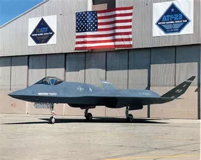 YF-23 from left front in front of hangar